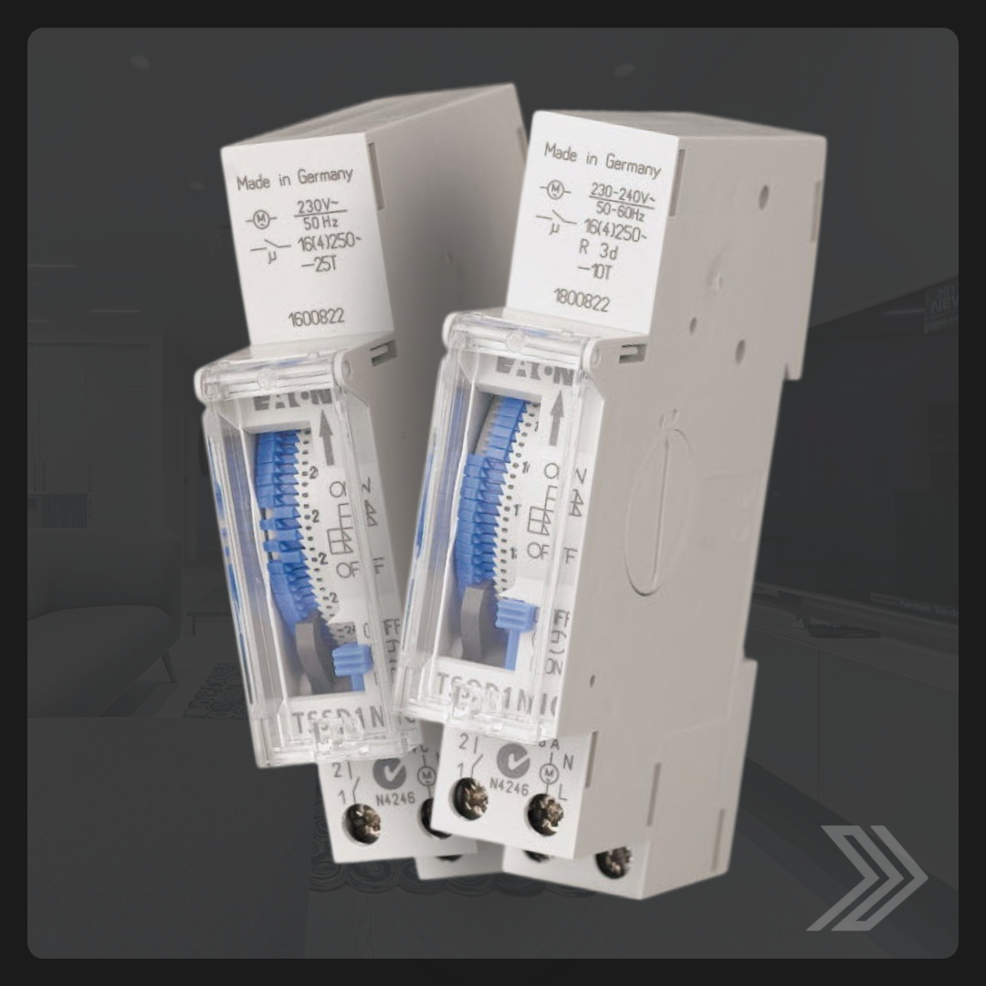 Click here for a close-up image of two 24-hour single pole analog timers with blue manual dials.