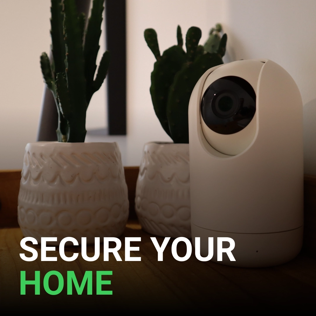 Click here for an indoor smart security camera next to potted plants with the text "Secure Your Home."
