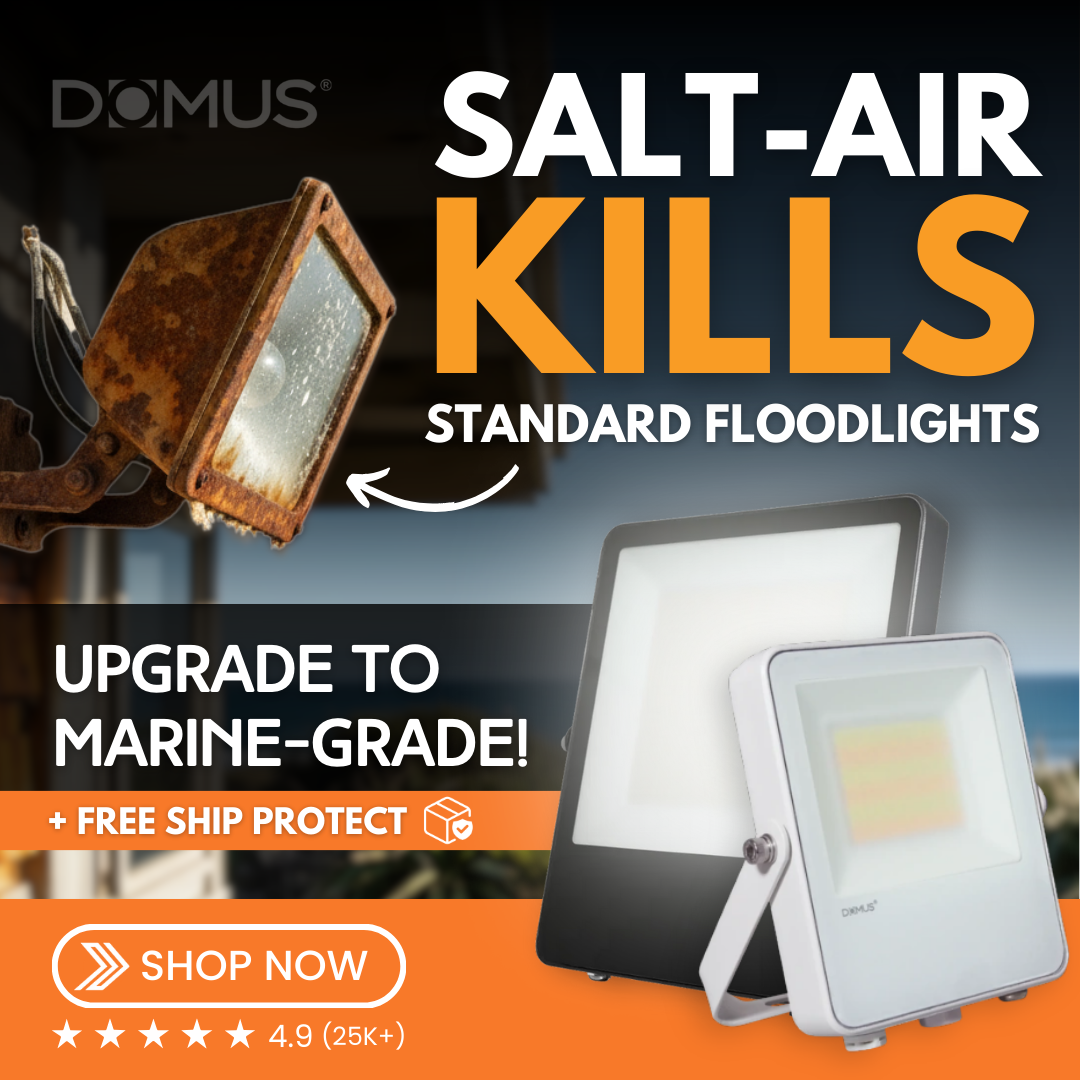 Ad showing a corroded floodlight next to two DOMUS marine-grade LED floodlights in black and white. Bold text reads “Salt-Air Kills Standard Floodlights – Upgrade to Marine-Grade!” with a 4.9-star business rating and “Shop Now” button.
