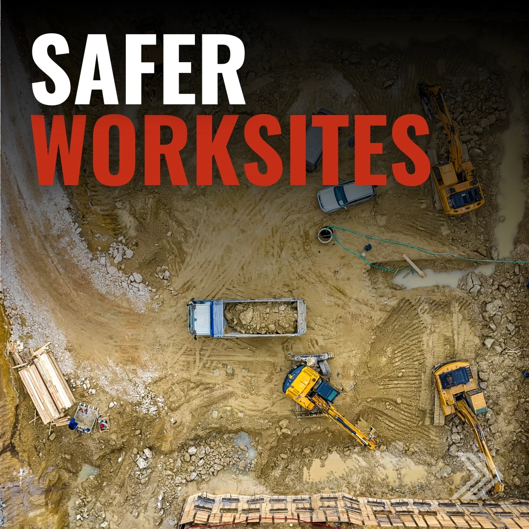Click here for a safer worksites ad showing an aerial view of a busy construction site with heavy machinery.