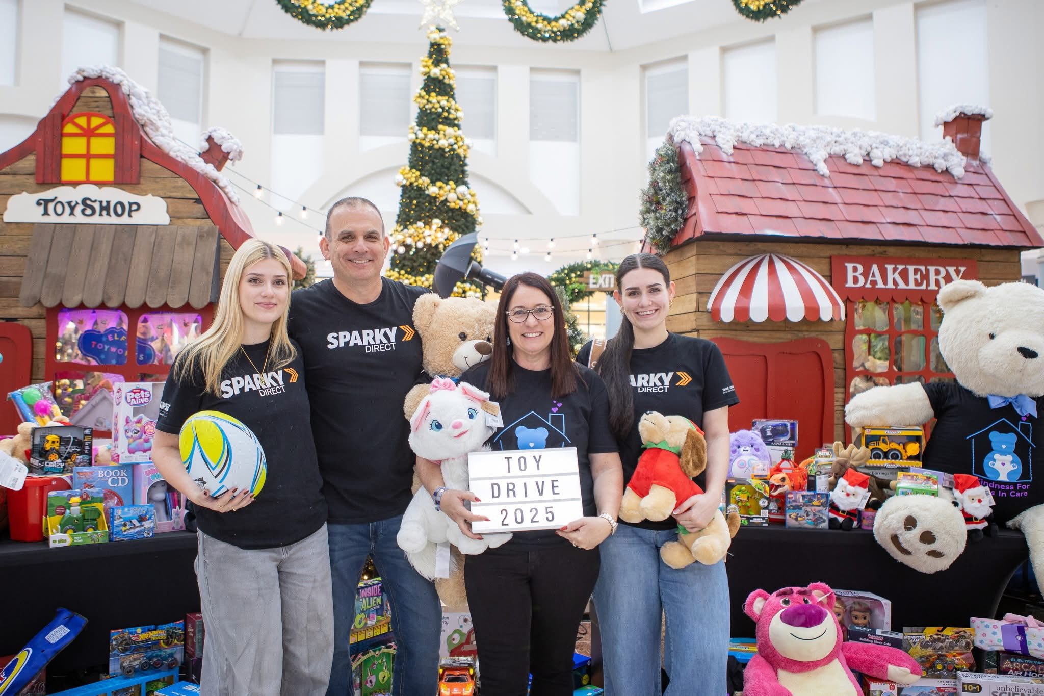 Wrapping presents at Sparky Direct for Kindness for Kids In Care.