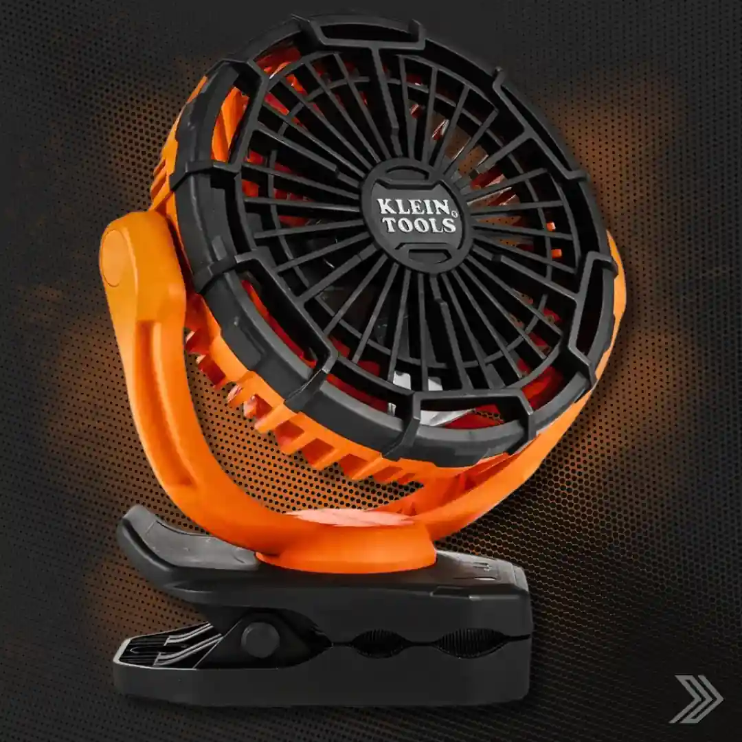 Click here for a close-up product shot of a rugged orange and black Klein Tools personal jobsite fan with clip base.