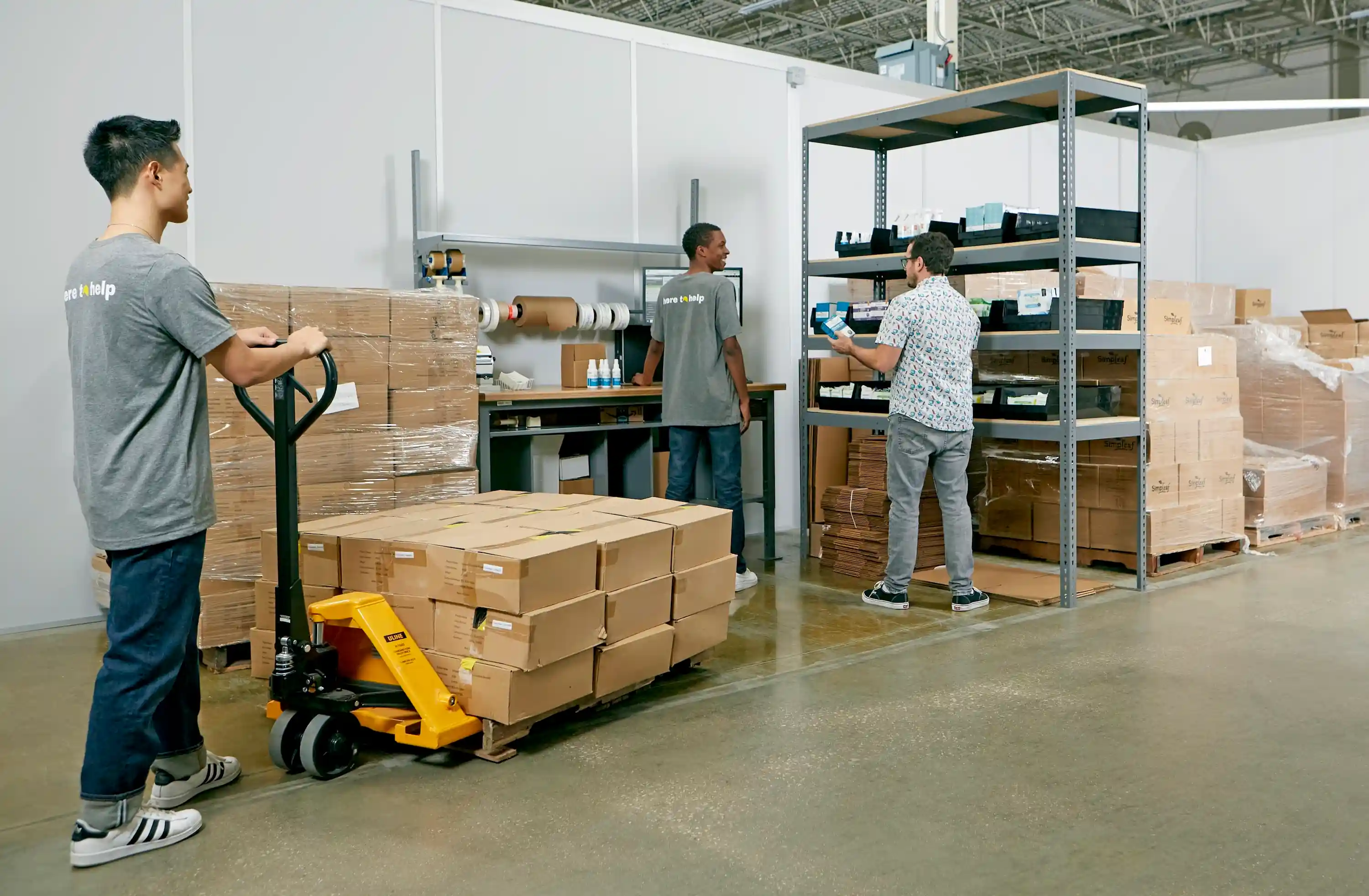 A product-business owner picking and scanning orders on warehouse shelving