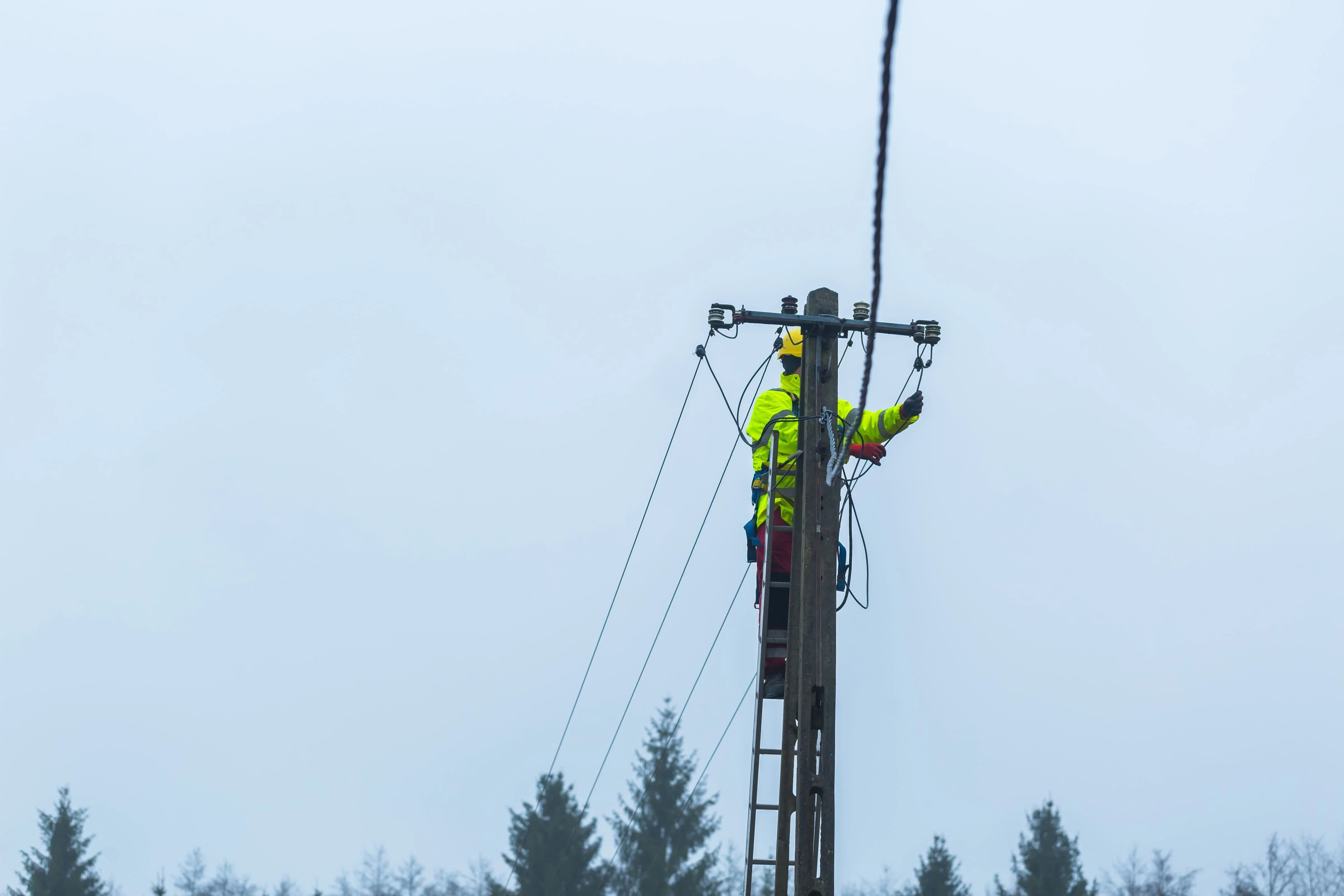 Line men work during storm response