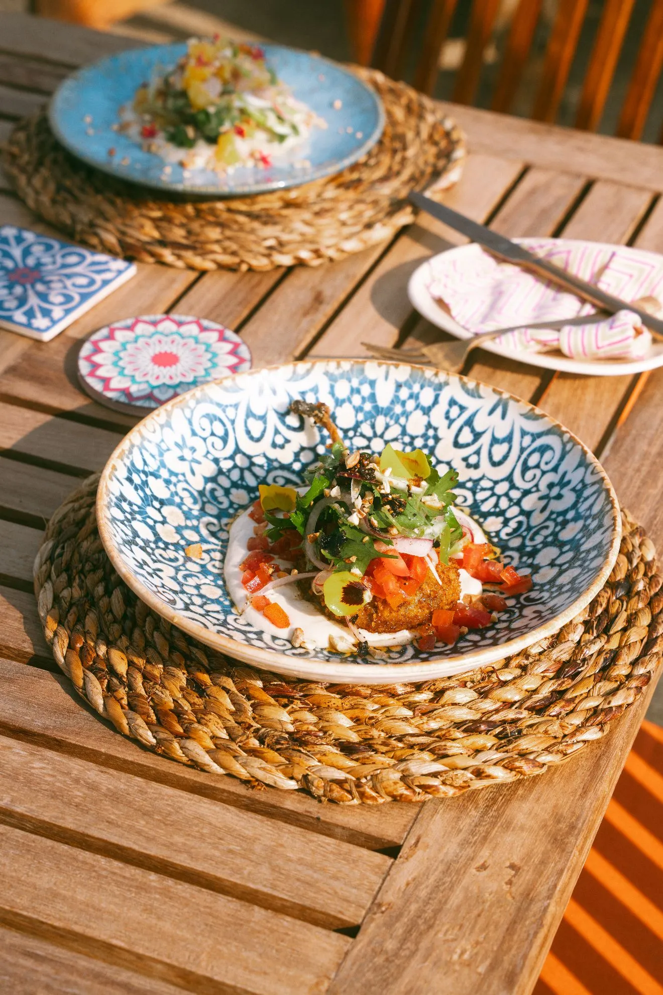 A plated dish served in evening light on Musafir