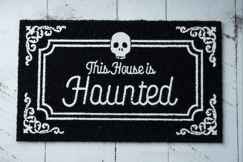 Glow-in-the-dark coir doormat showing its luminous design at night