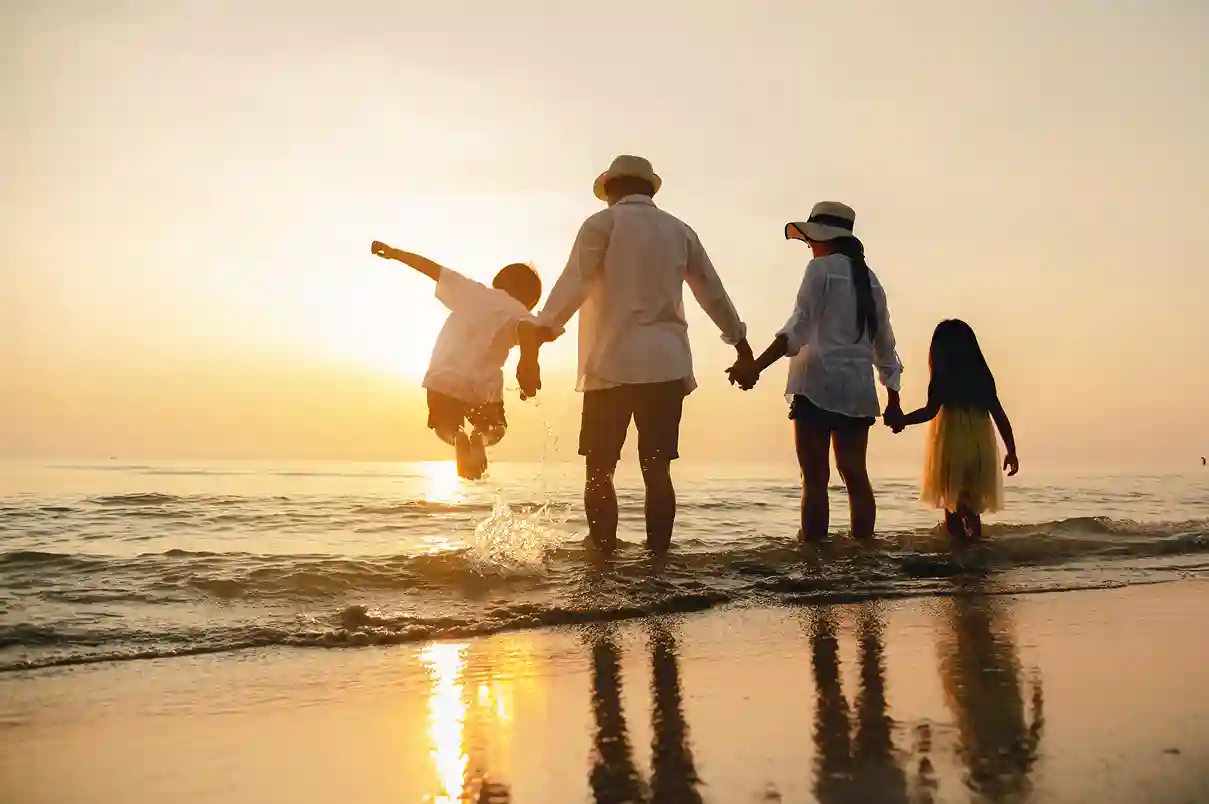family in day off in front of the sea
