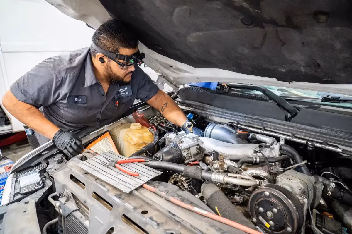 Diesel mechanic performing HVAC System repair services in Fontana, CA