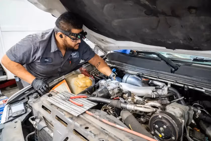 Diesel mechanic performing HVAC System repair services in Fontana, CA