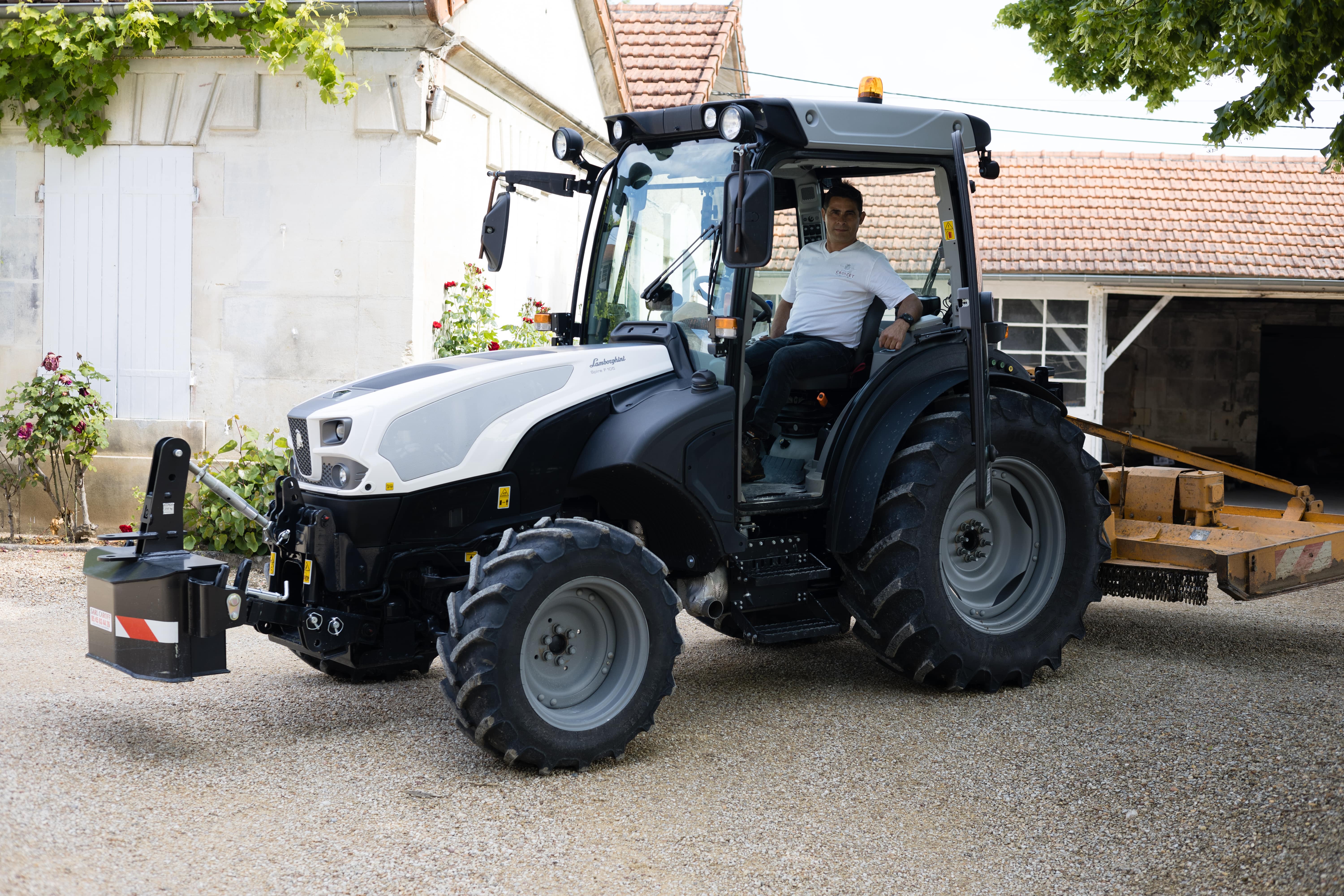 Manuel de Santos driving an eco-friendly tractor through Croizet vineyards