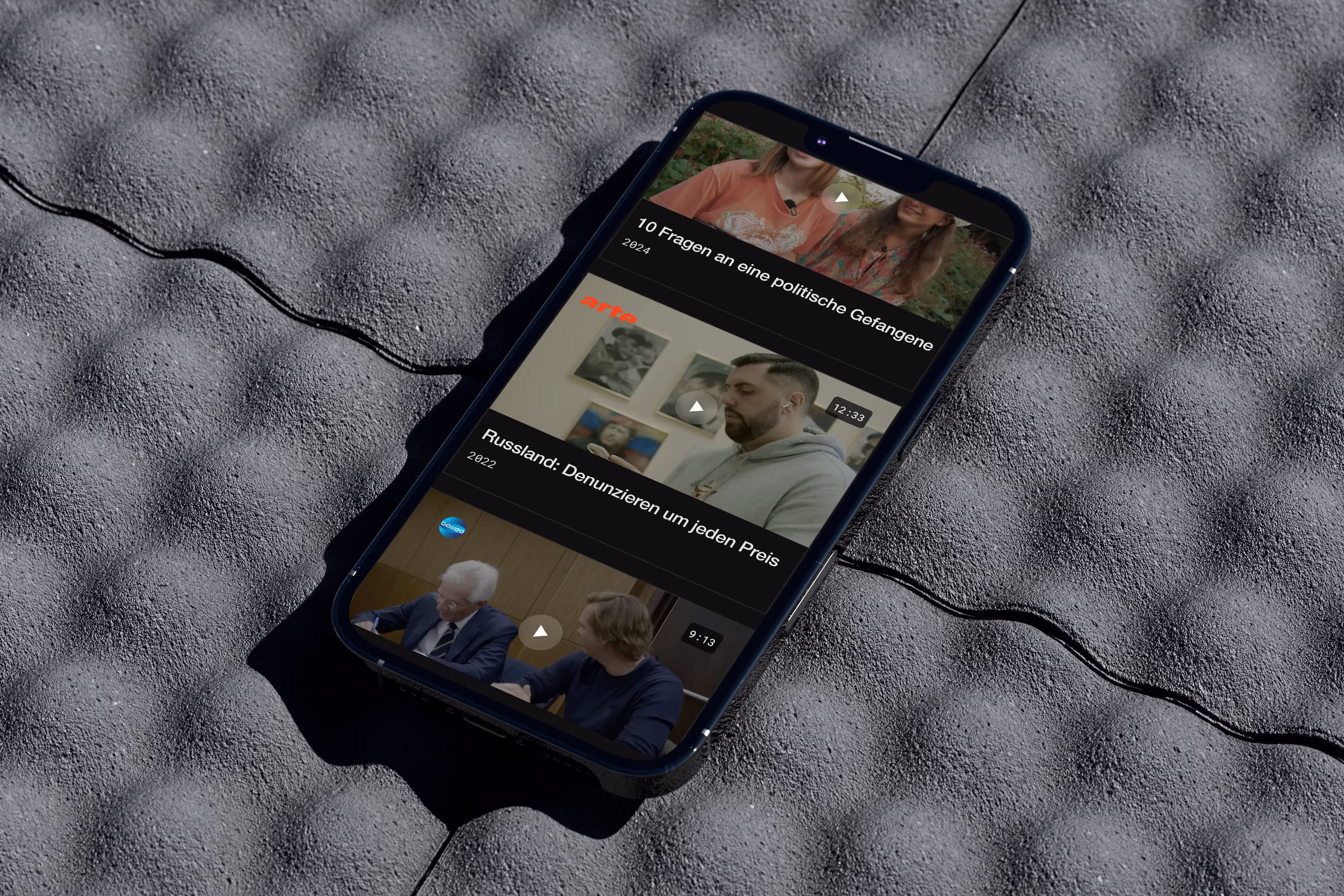Webflow redesign project for Reporter with a textured black object on a grey surface