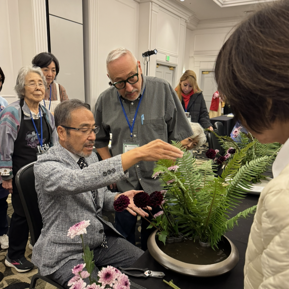 Joe Rotella's Ohara traditional arrangement being critiqued by Professor Hirokazu Yokohigashi from the Ohara School, Japan