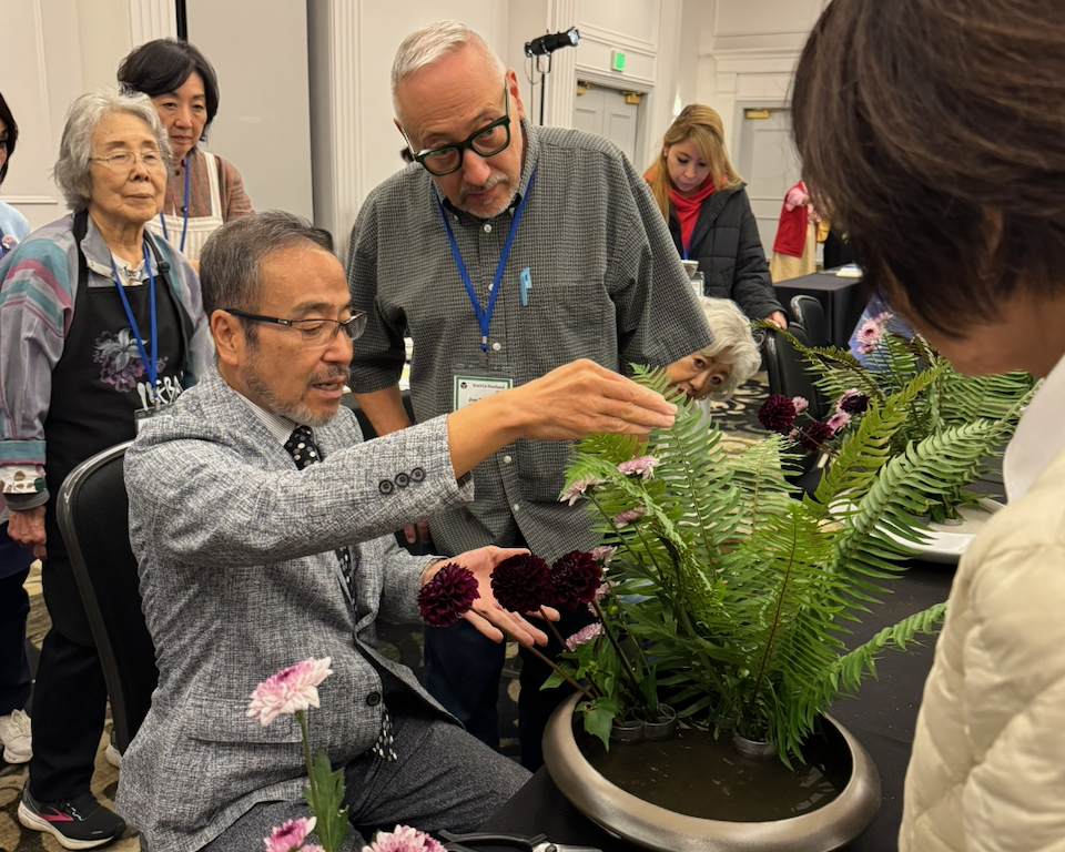 Joe Rotella's Ohara traditional arrangement being critiqued by Professor Hirokazu Yokohigashi from the Ohara School, Japan