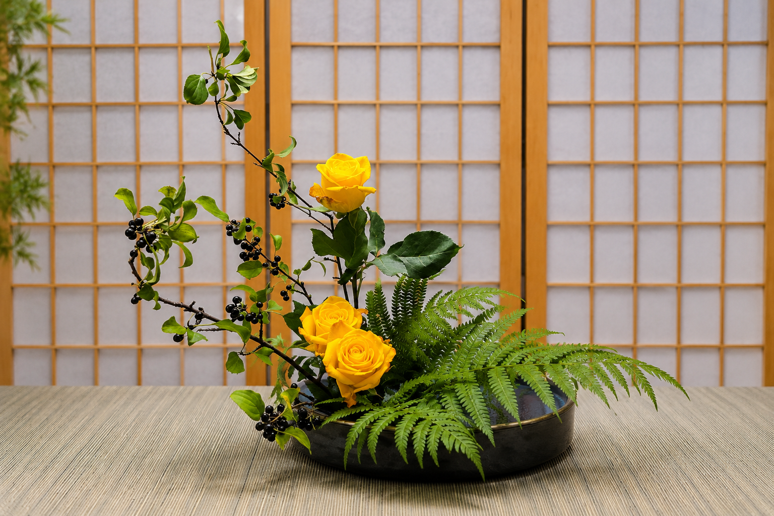 Ohara Ikebana Moribana Upright Style arrangement with buckthorn branches, yellow roses, and fern in a shallow black suiban.