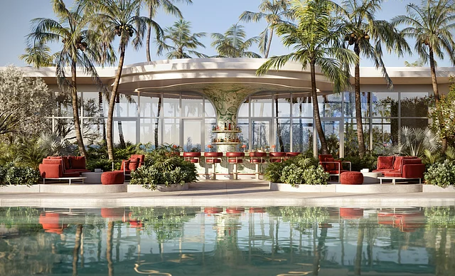 Outdoor poolside bar with red seating and lush palm trees