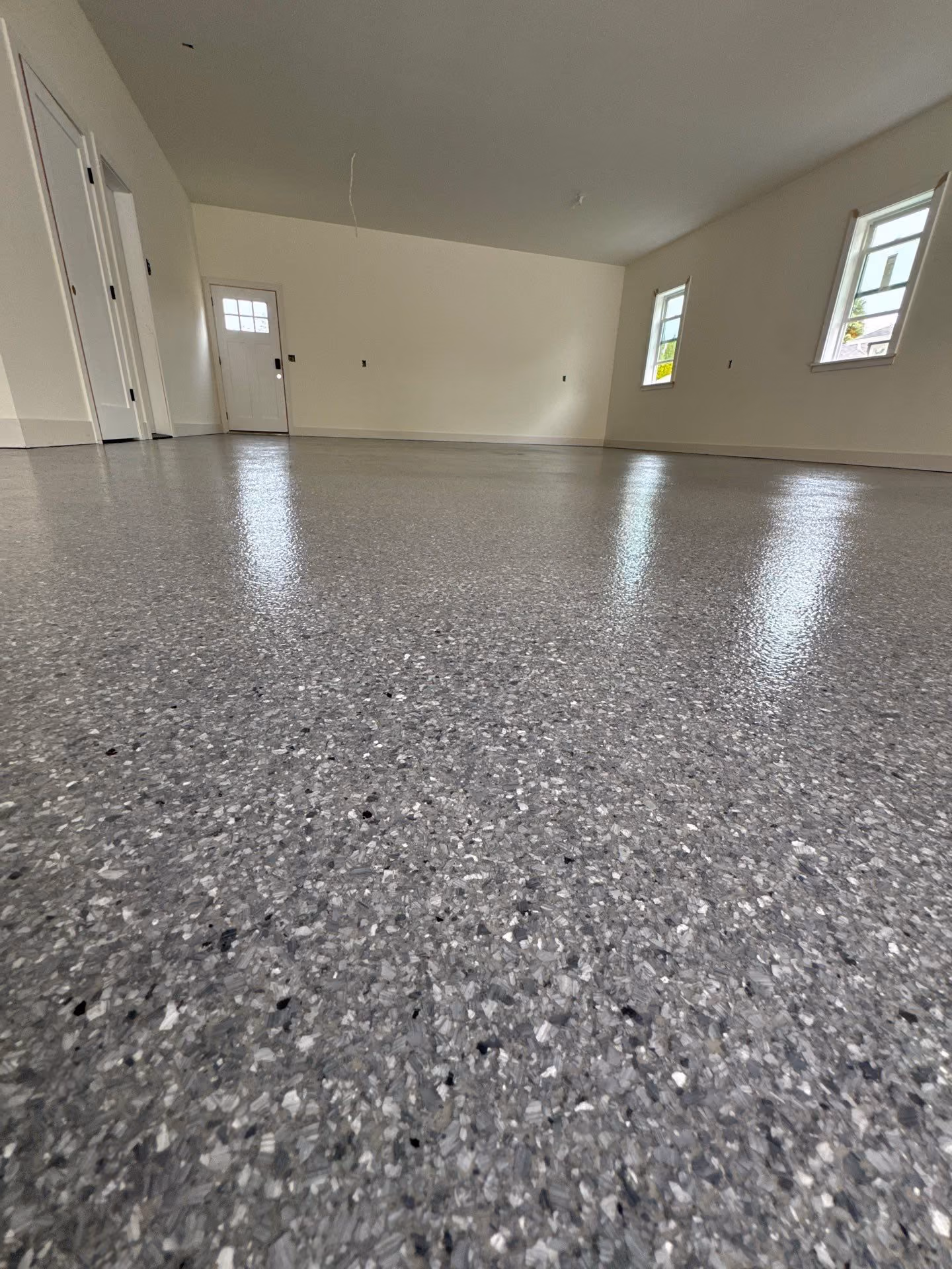 Granite Enviroflake epoxy flake floor by Cascade Concrete Coatings