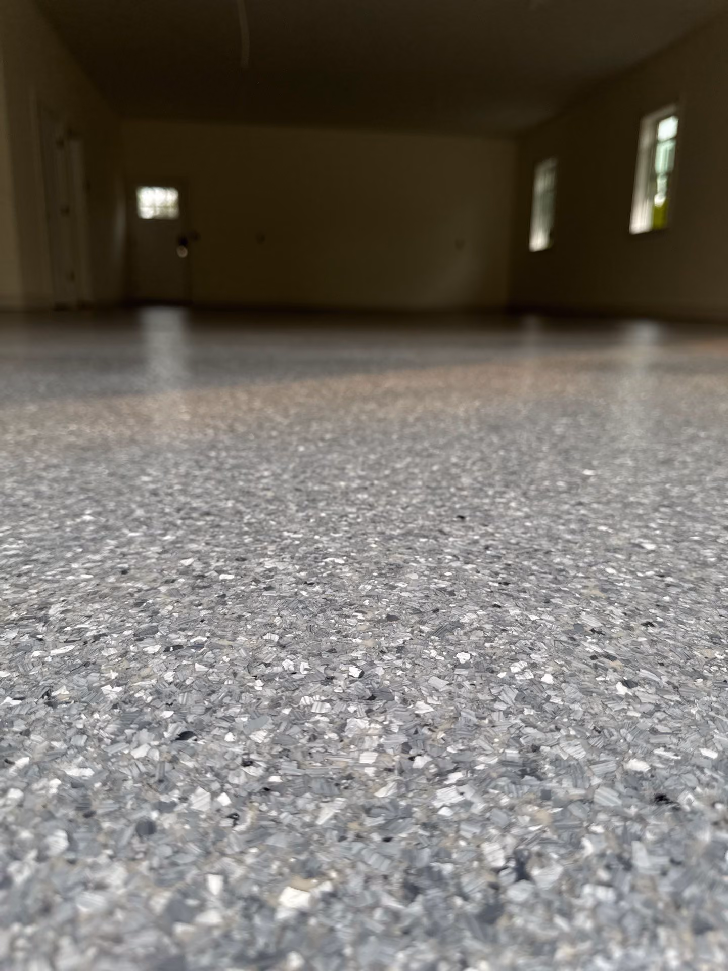 Granite Enviroflake epoxy flake floor by Cascade Concrete Coatings