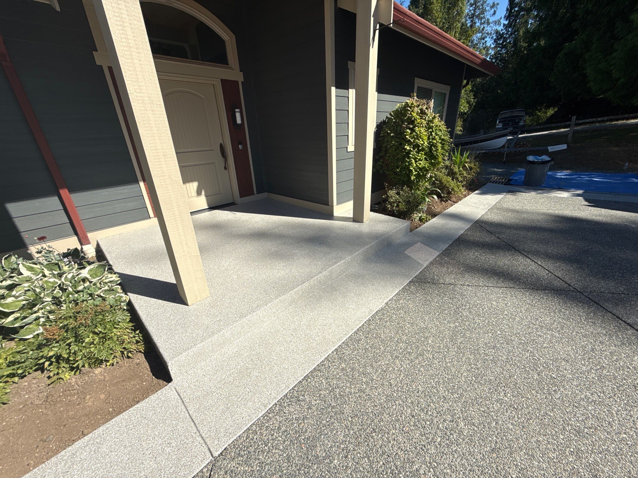 Quartzite flake polyurea porch and walkway at a Mount Vernon home with grey siding