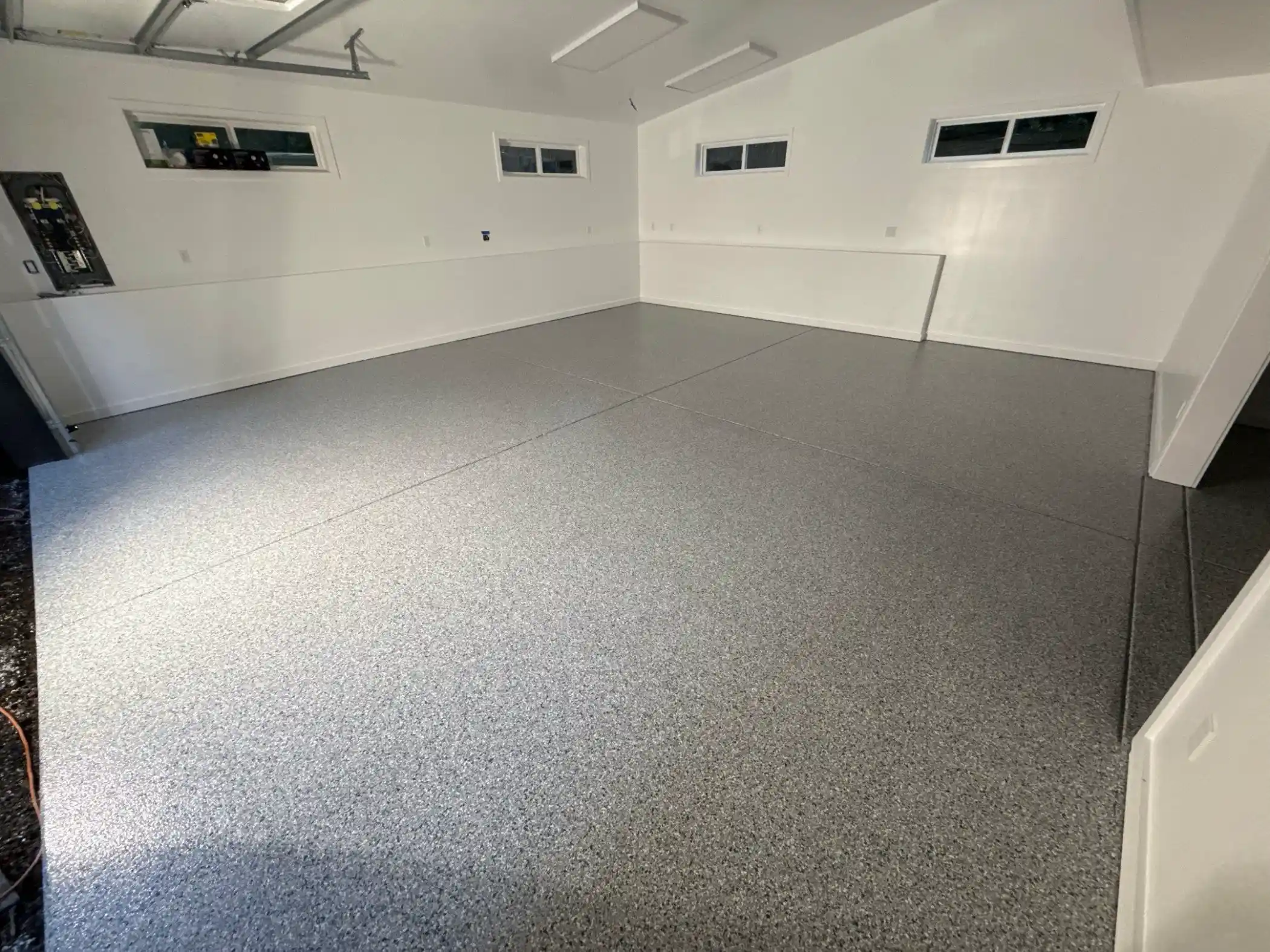 Modern Woodinville garage with Tidal Wave flake floor and high clerestory windows