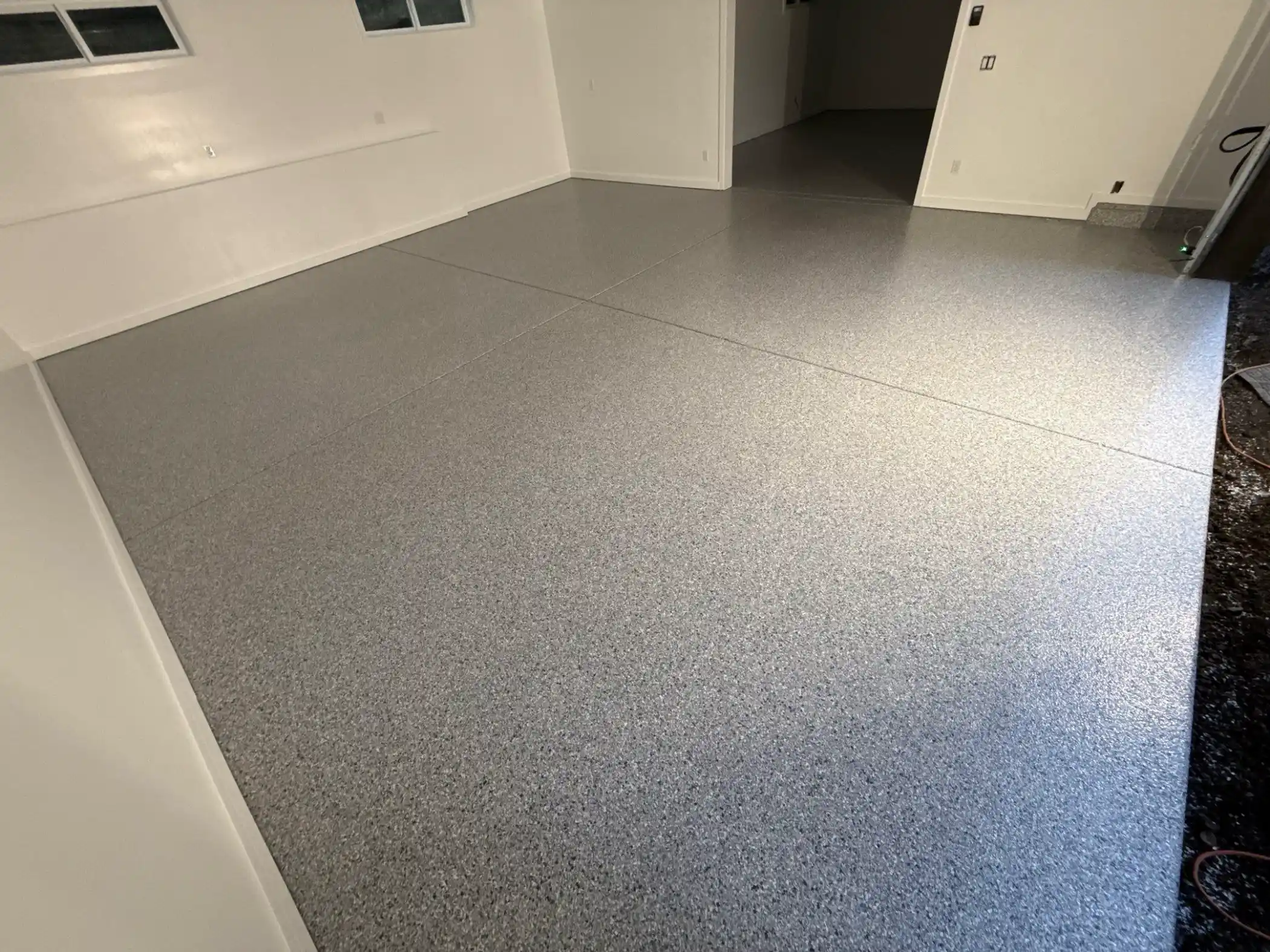 Tidal Wave flake garage floor leading to a side door in Woodinville