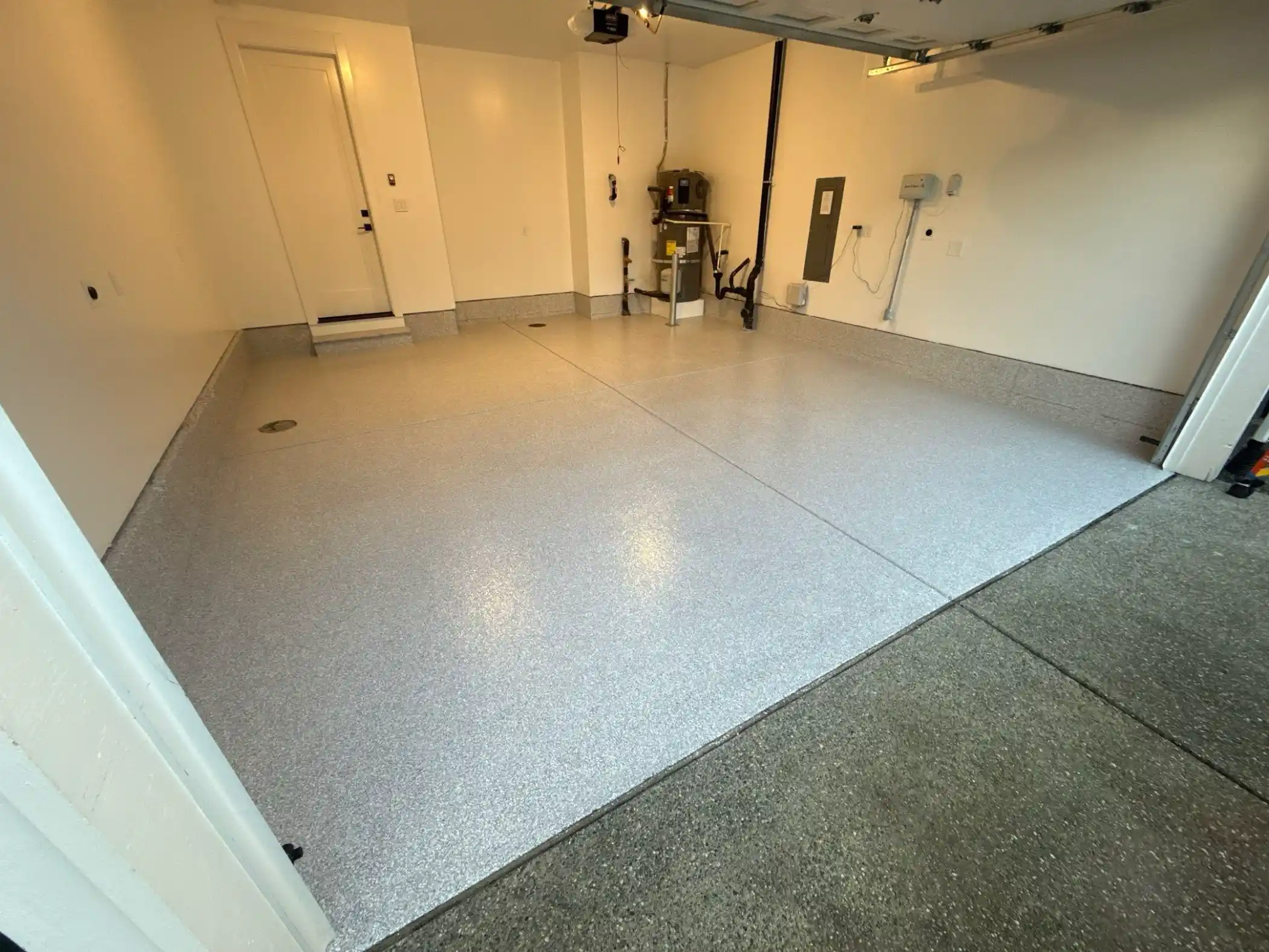 Wide view of a Duvall garage coated in Ash Enviroflake polyurea
