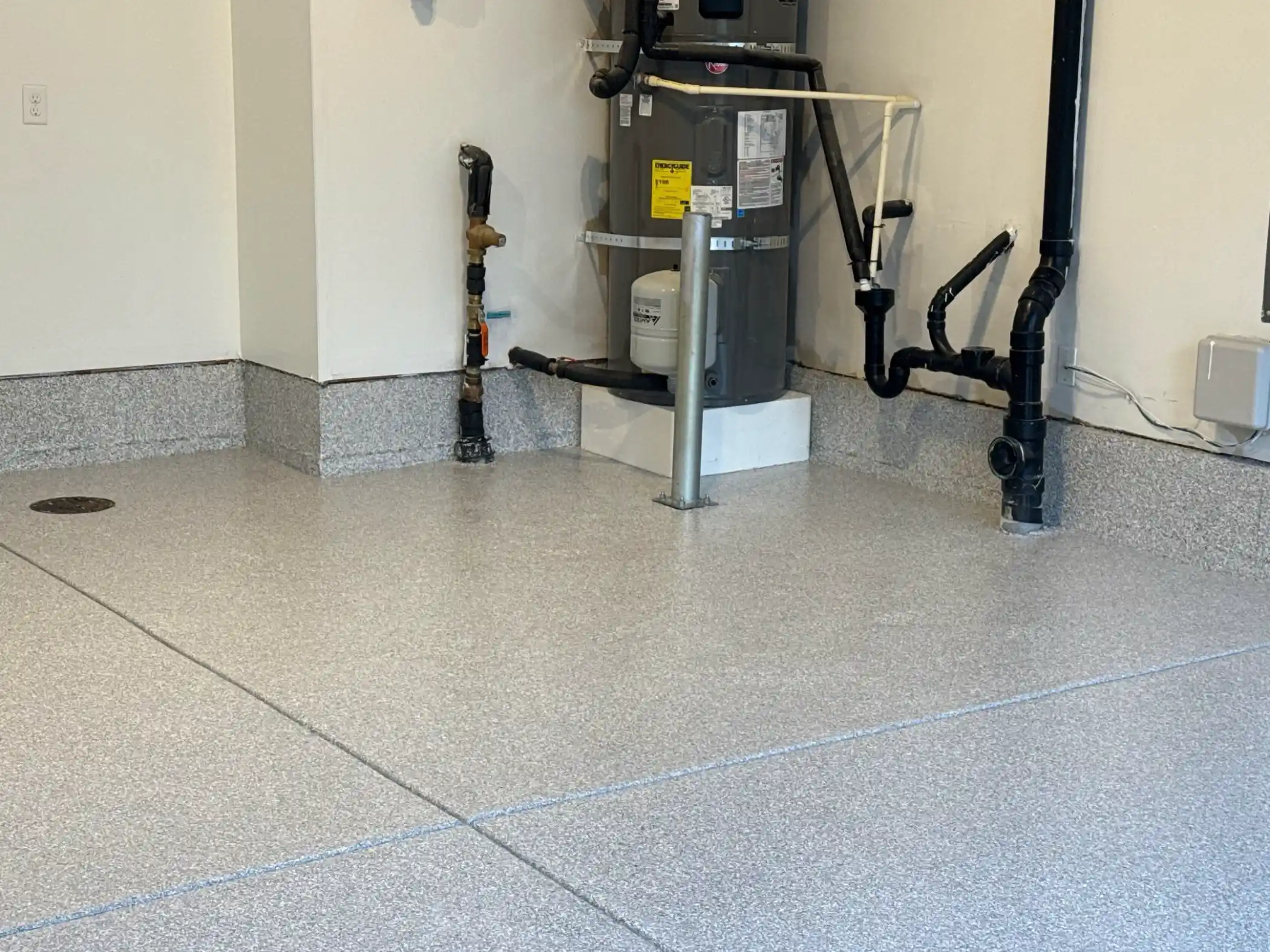 Finished Ash flake garage floor under warm lights in Duvall