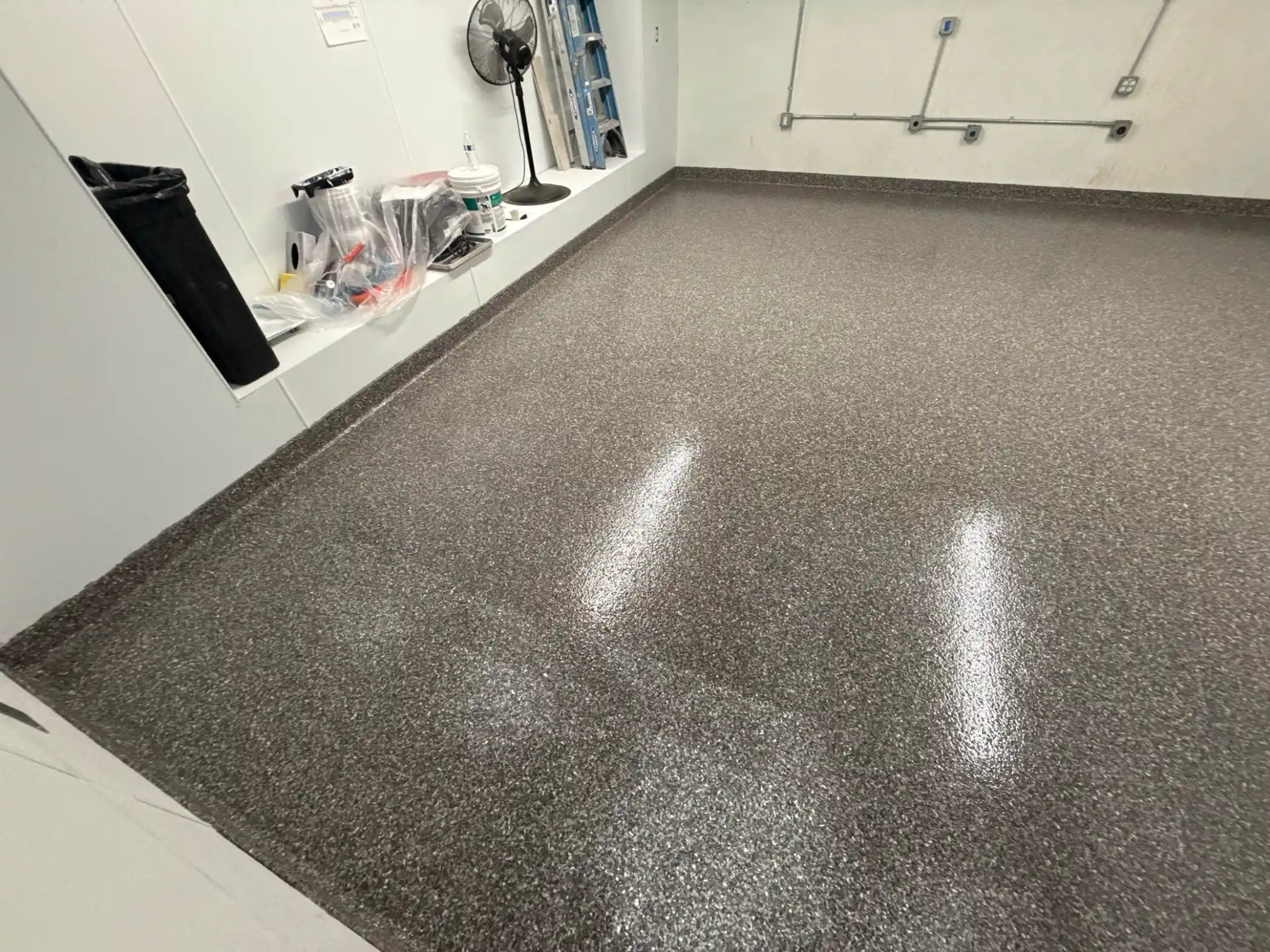 Glossy Silver Creek flake commercial floor along white walls in Seattle