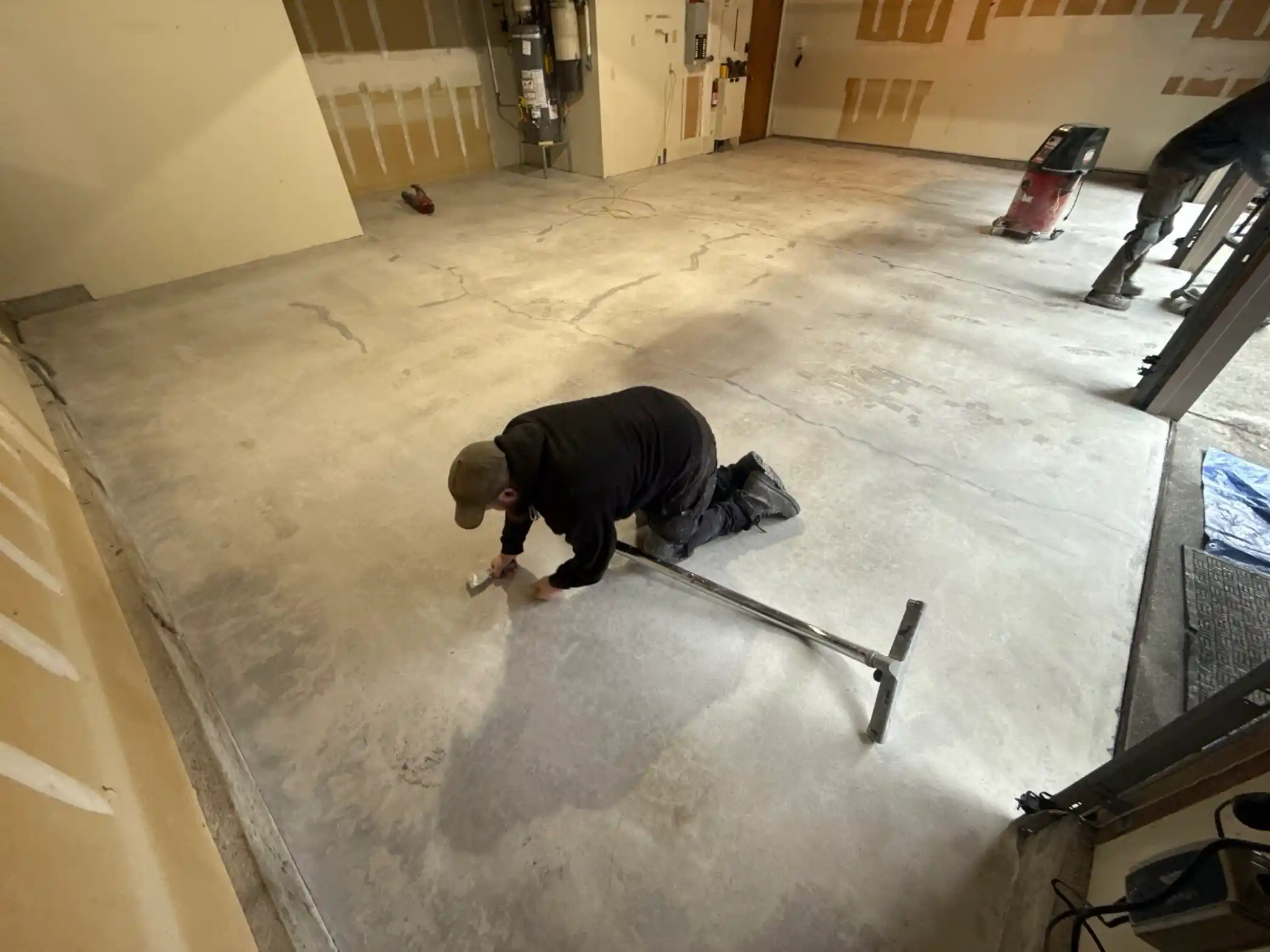 Cascade crew prepping a bare concrete garage slab in Edmonds before the Smoke coating