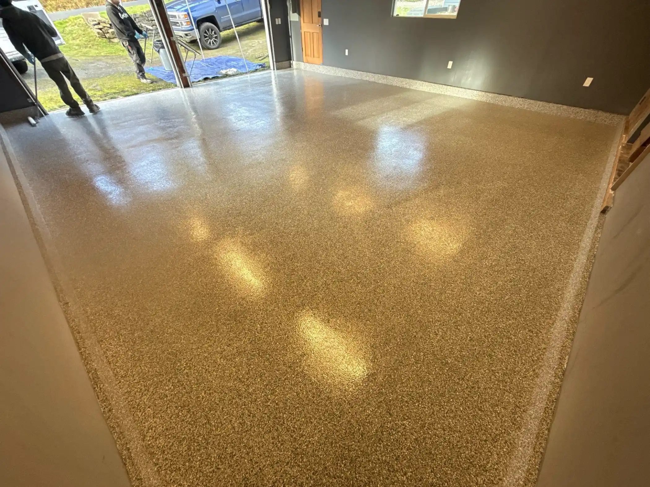 Light reflecting off a new Slate Stone flake floor in a Camano Island garage