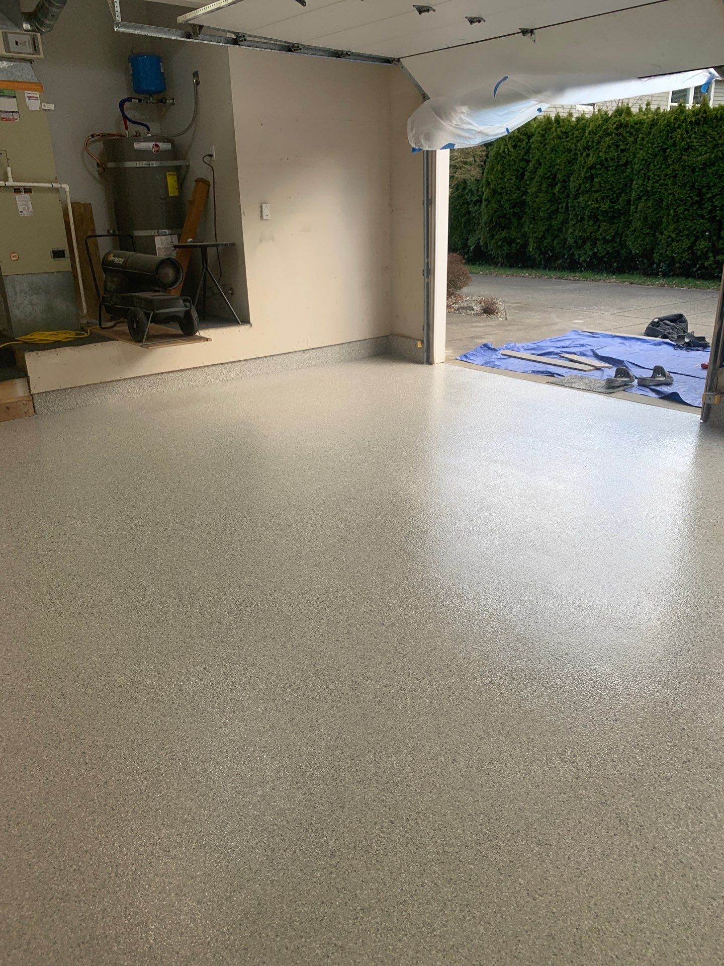 Mount Everest flake polyurea garage floor opening onto the driveway in Gig Harbor