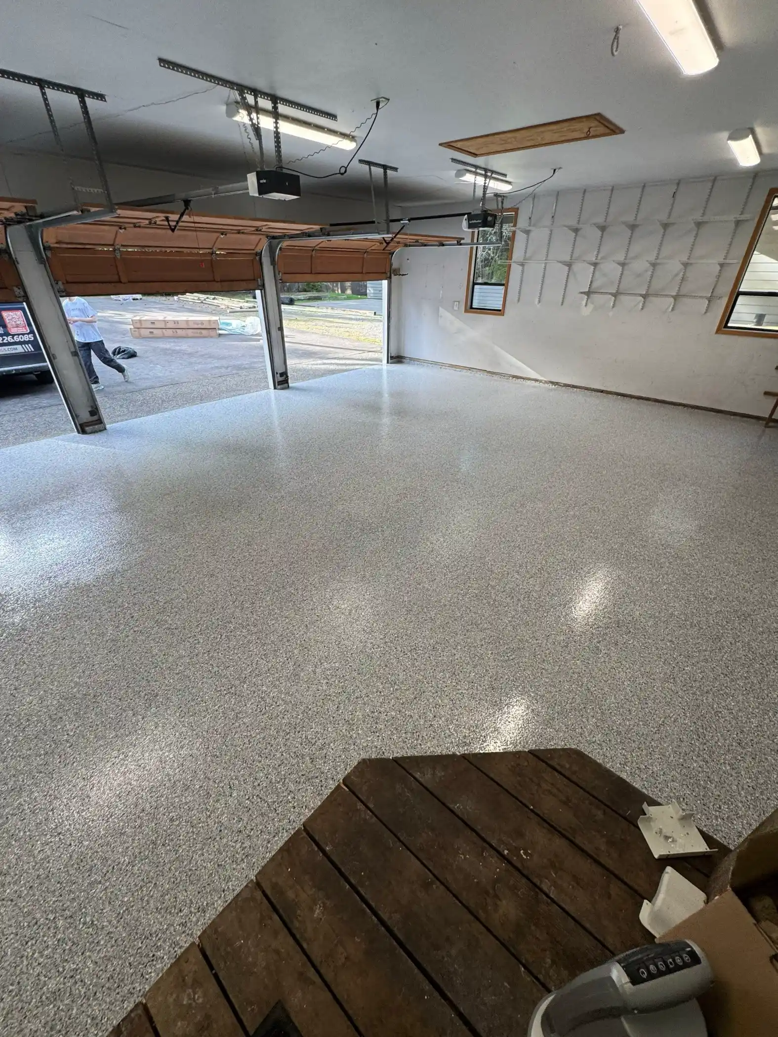 Tidal Wave flake floor with cedar garage doors and wood landing on Fox Island