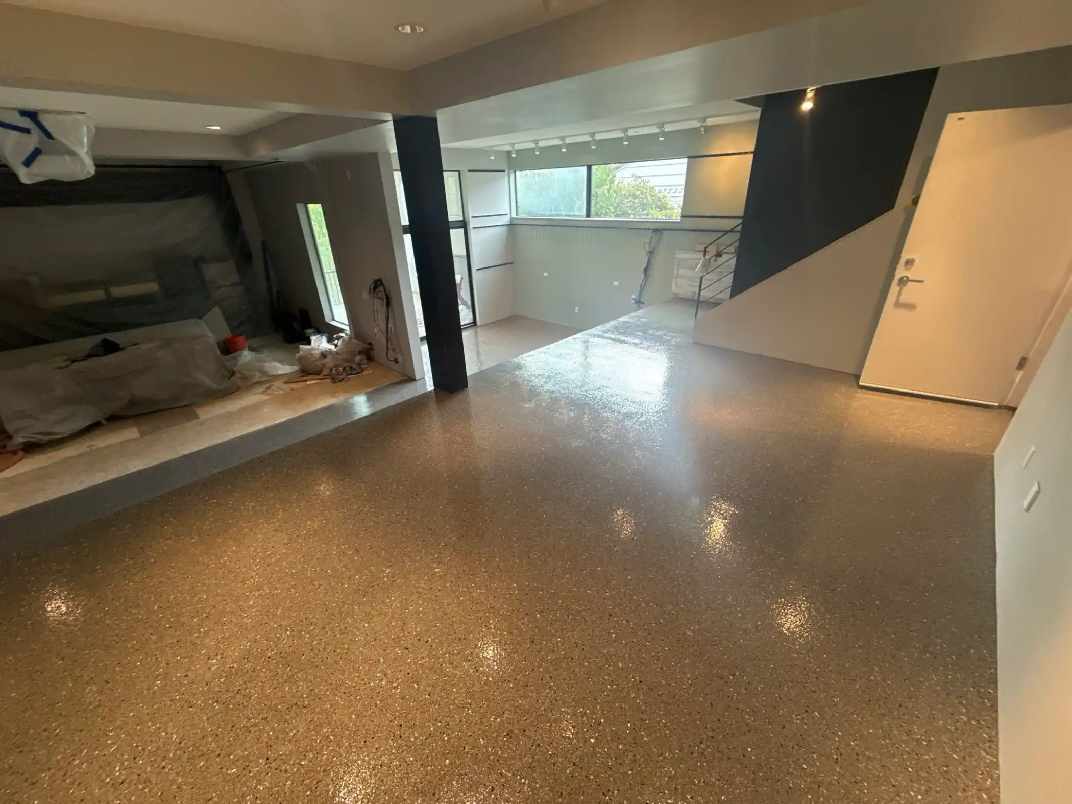 Seattle lower level with Slate polyurea floor, steel post and entry door