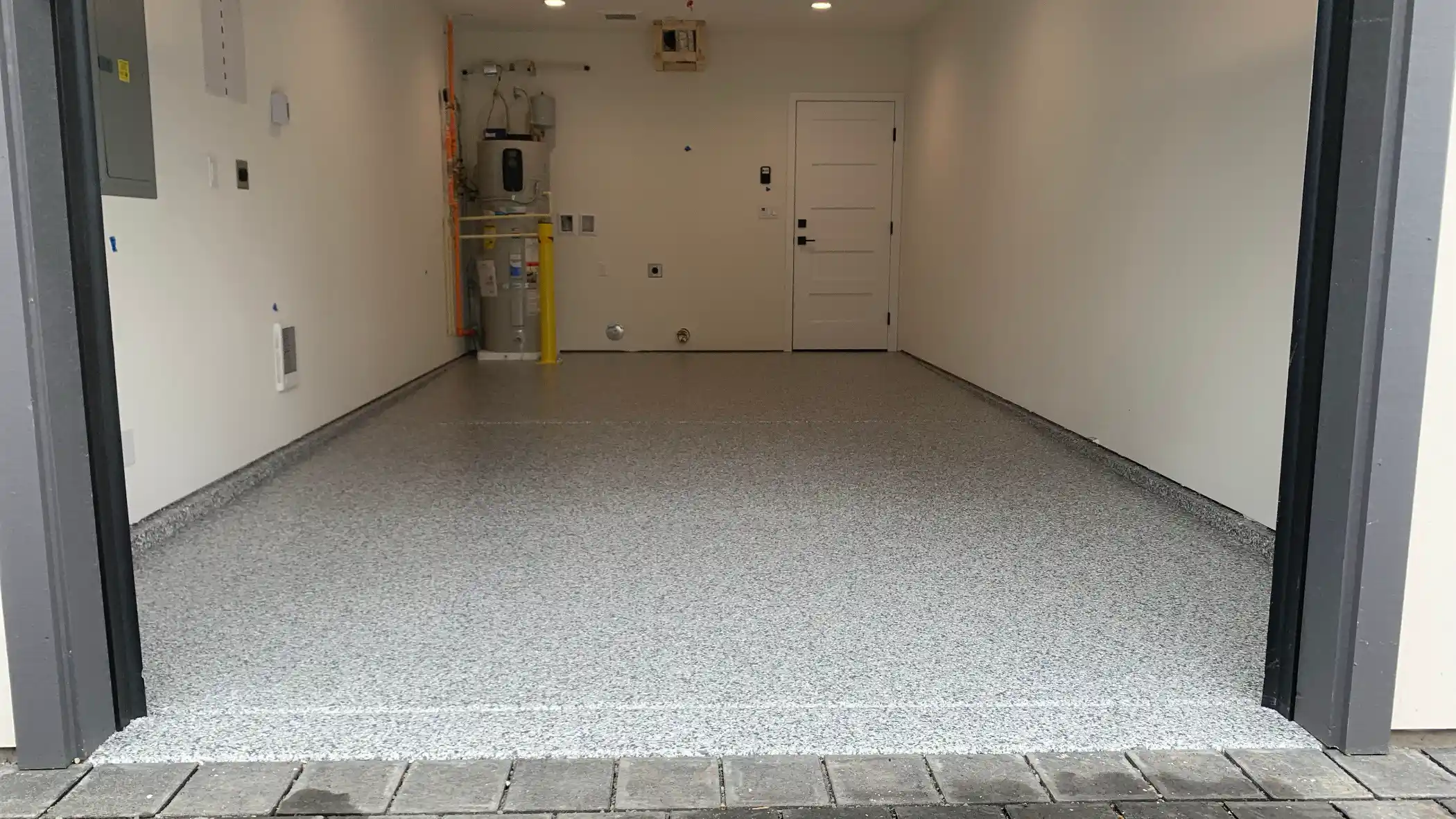 Long new-build garage in Shoreline with a Slate Stone flake polyurea floor