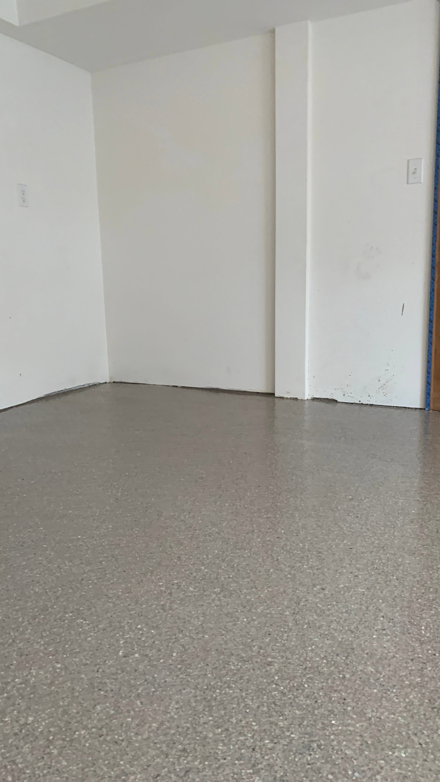 Fieldstone flake polyurea floor in a Seattle garage converted to an office