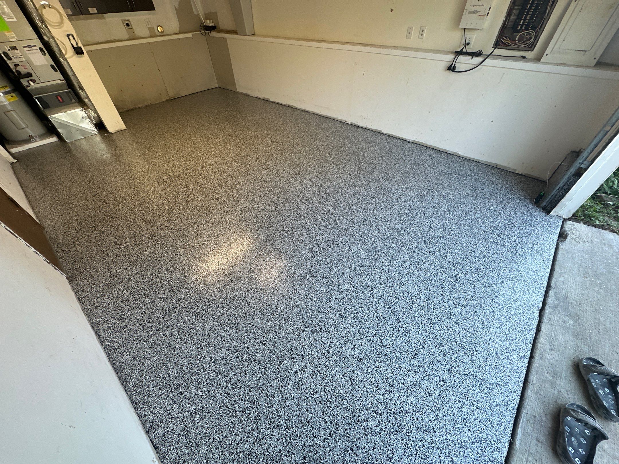 Single-car Duvall garage with a new Domino flake polyurea floor