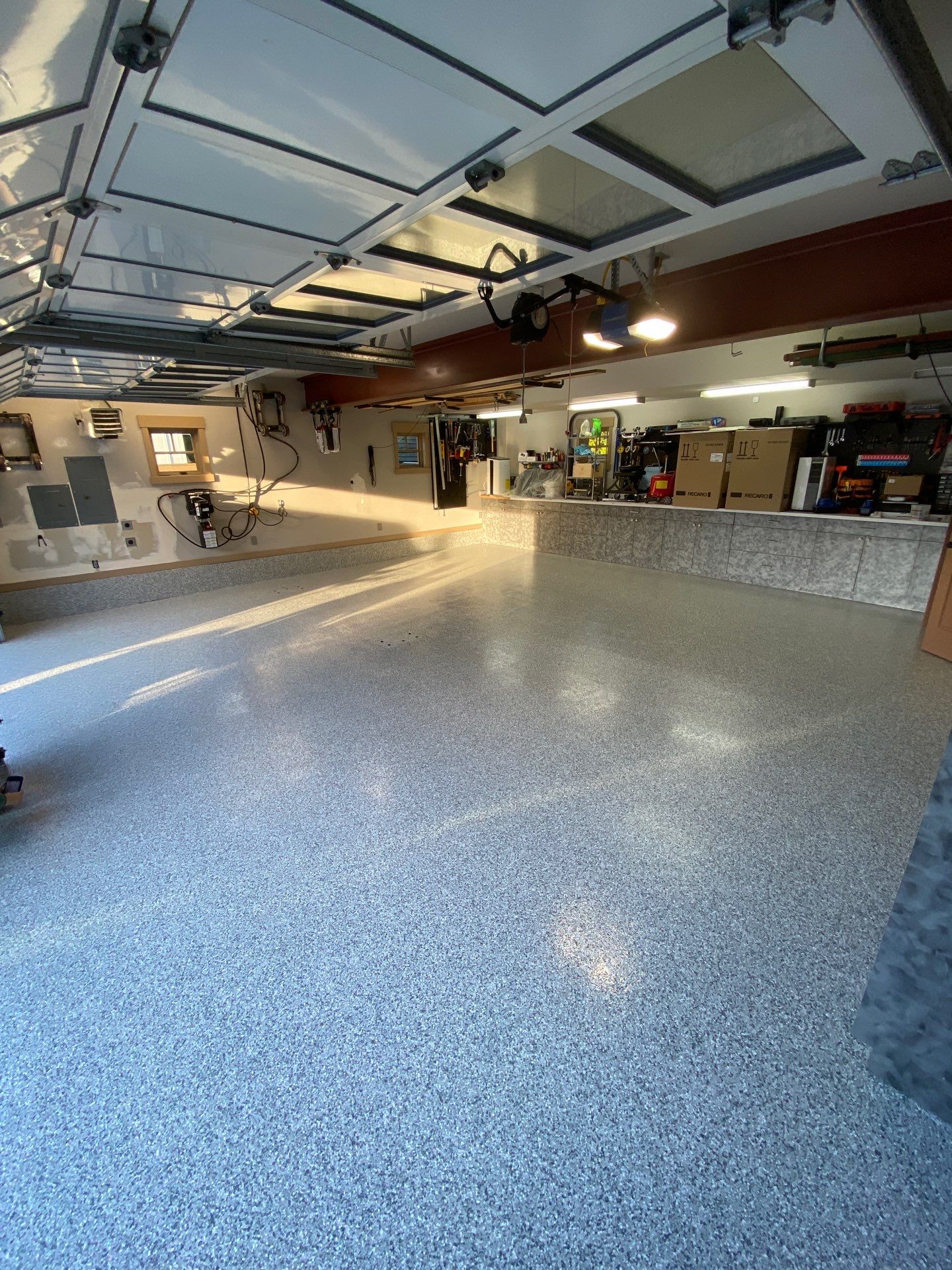 Slate Stone flake garage floor with workbench counter and stone veneer in Woodinville