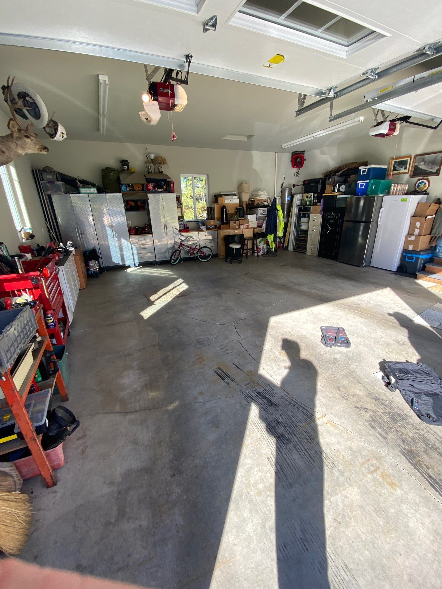 Cle Elum garage with stained bare concrete before coating