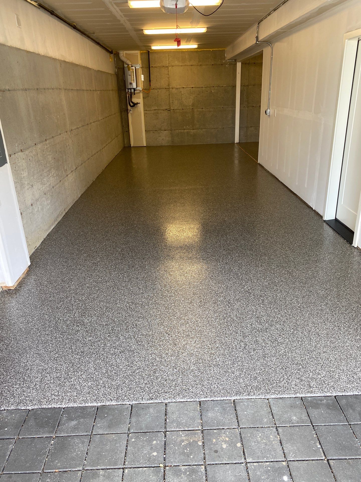 Kirkland garage with glass door and new Silver Creek polyurea floor coating