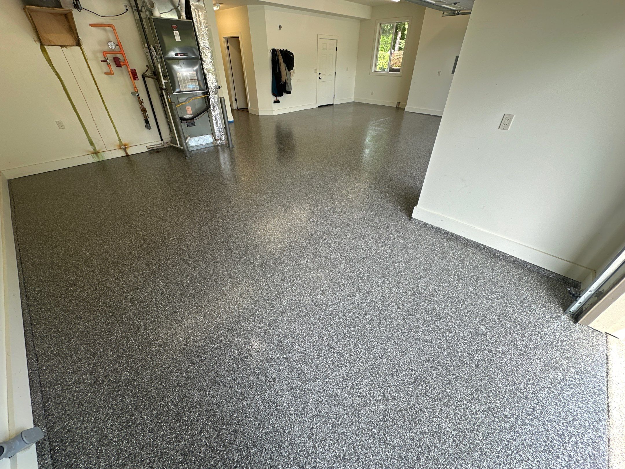 Silver Creek flake polyurea garage floor toward the house door in Enumclaw