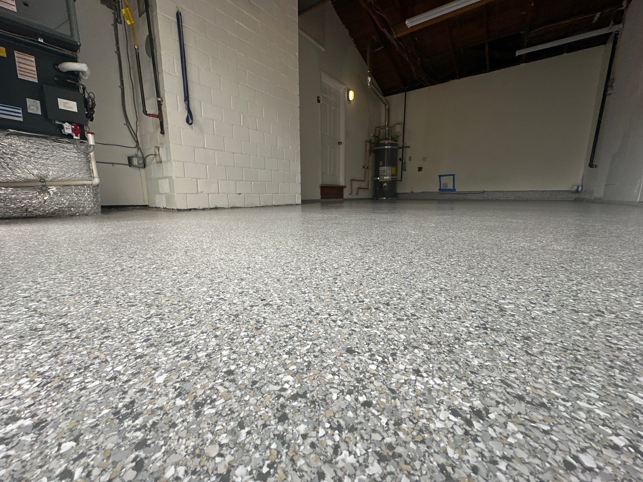 Edmonds garage with a finished Mount Everest flake floor and white walls
