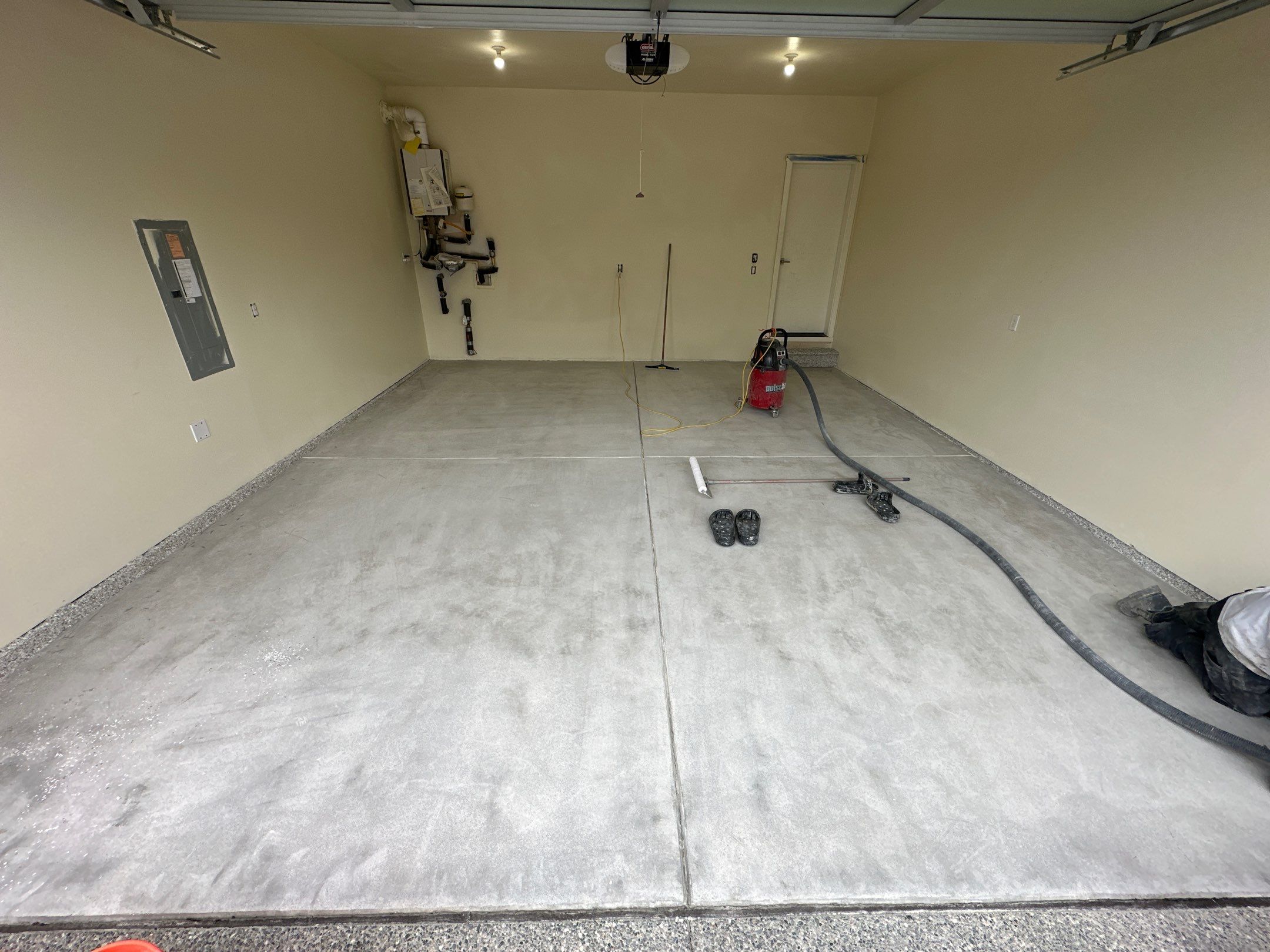 Bare ground concrete in a Bothell garage before the Mount Everest coating
