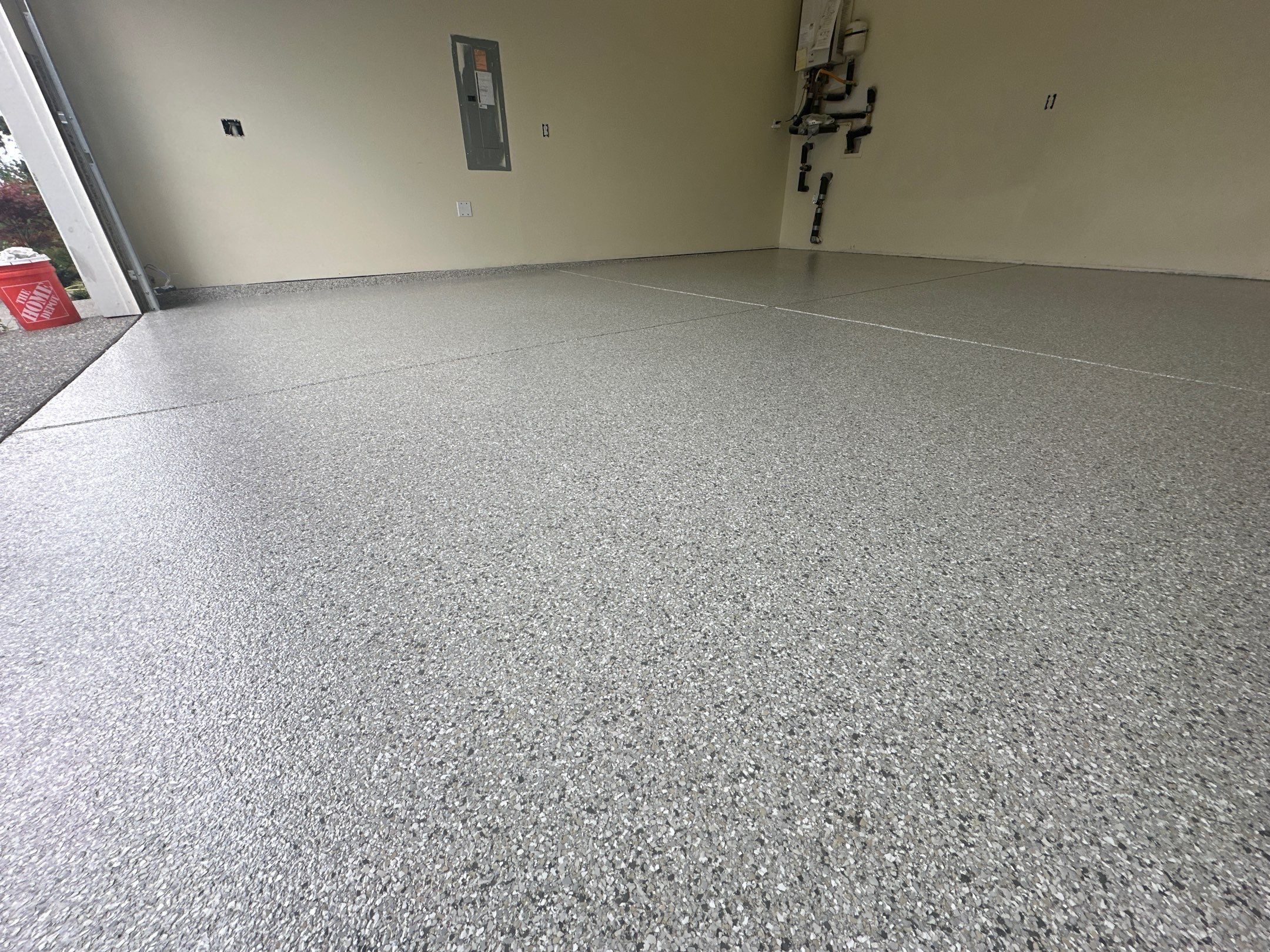 Wide Mount Everest polyurea garage floor with control joints in a Bothell home