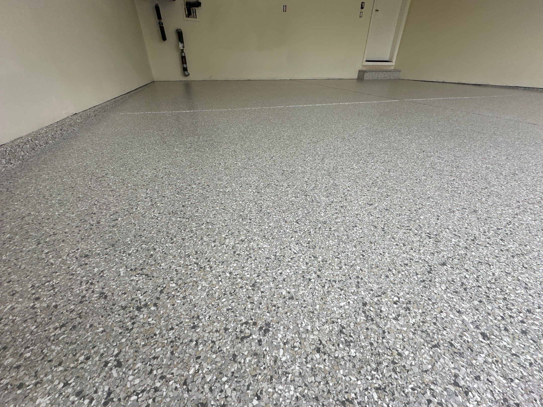 Even Mount Everest flake coverage across a two-car garage floor in Bothell