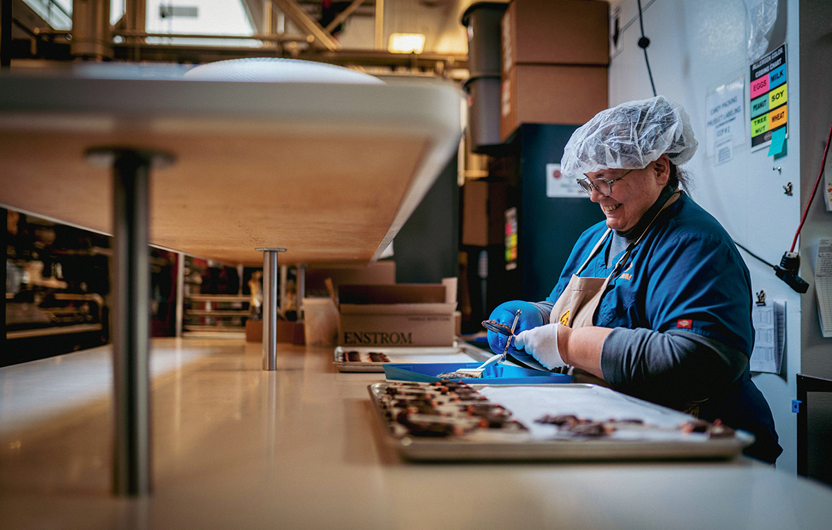 Artisan confectioners preparing toffee confections at Enstrom Candies in Colorado