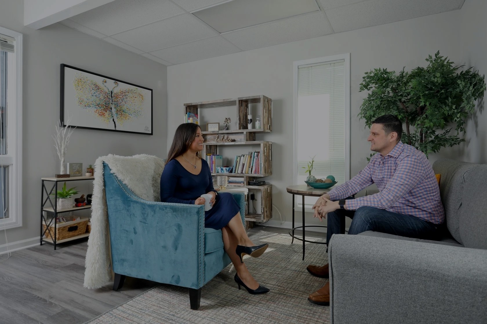 Therapist and client talking in a bright counseling office