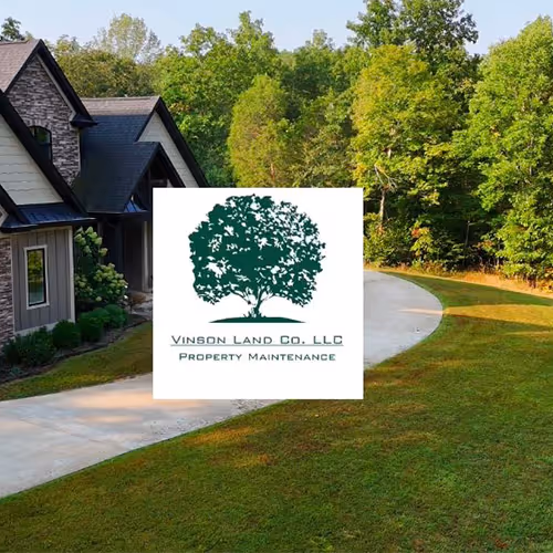 A neatly mulched garden bed with vibrant plants and rich, dark mulch.