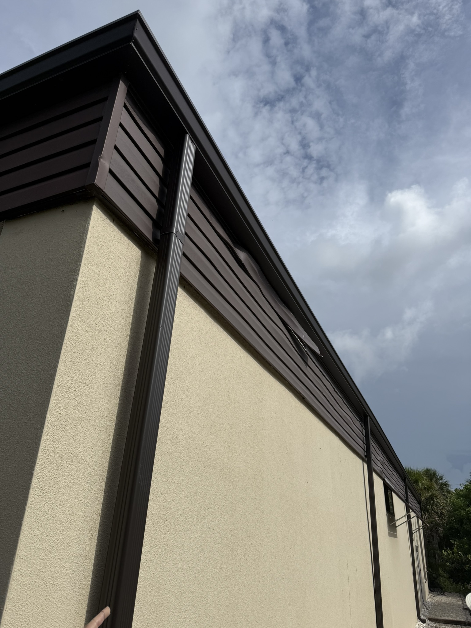 Removal and replacement of siding on one elevationof the Post office building on Captiva Island