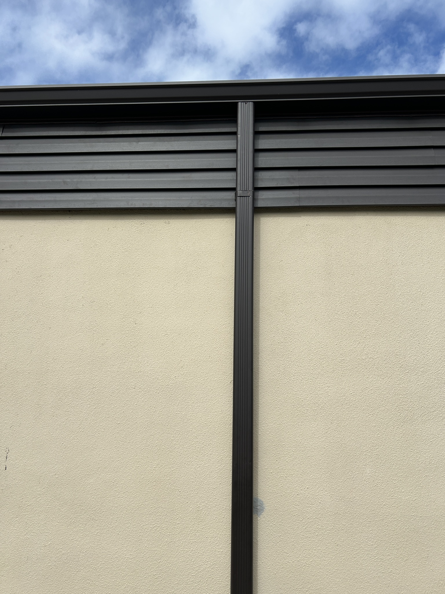 The new vinyl siding will be a close match to the existing aluminum siding on the other three elevations.