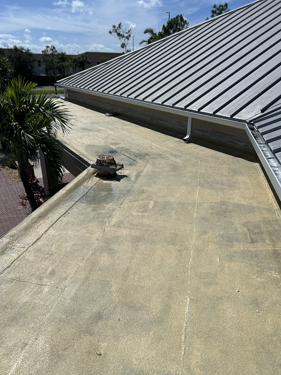 Apply Geco brand cleaner, primer and silicone roofing system over the cleaned roof surface, ensuring full coverage in accordance with manufacturer specifications.