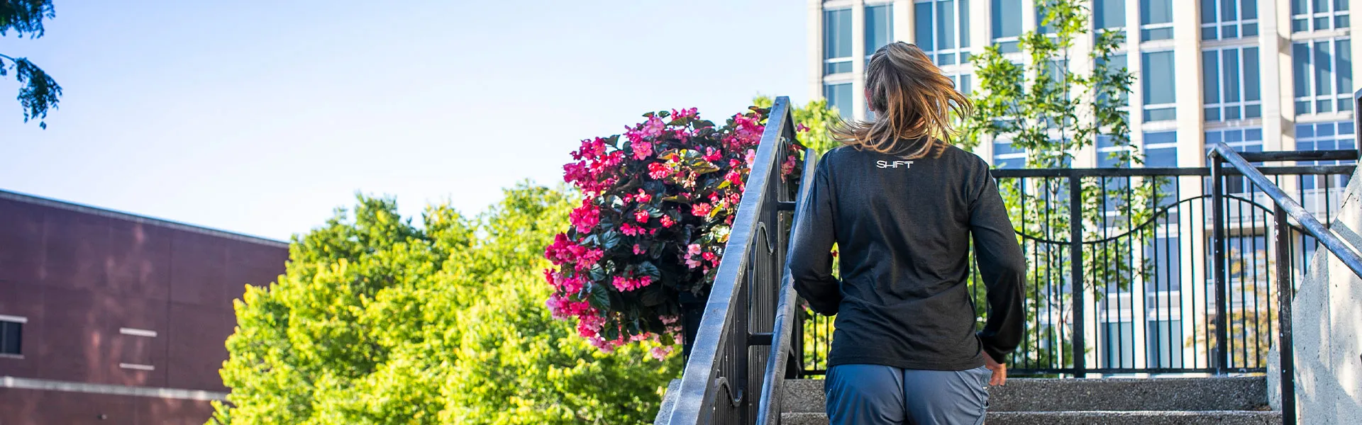 Woman jogging runs up the stairs in Chicago, IL